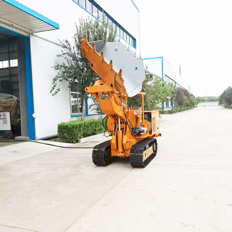 Cargador de rocas de descarga lateral con control remoto