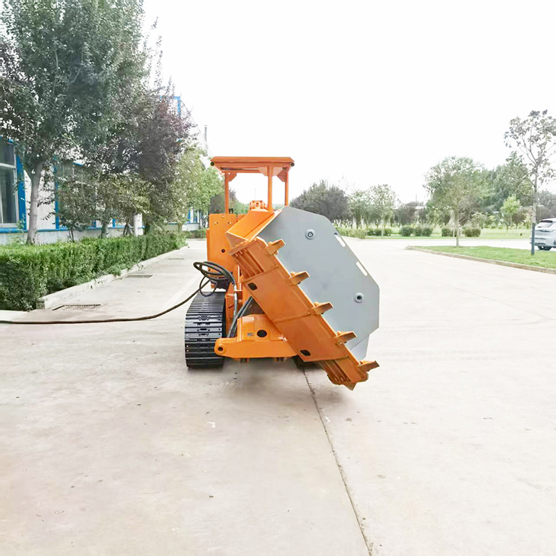 Cargadora de rocas con volquete lateral sobre orugas