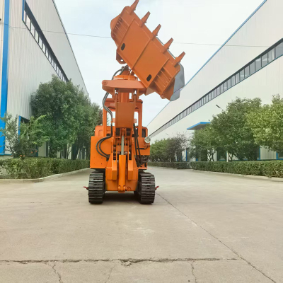 Chargeuse de roches à déchargement latéral de tunnel